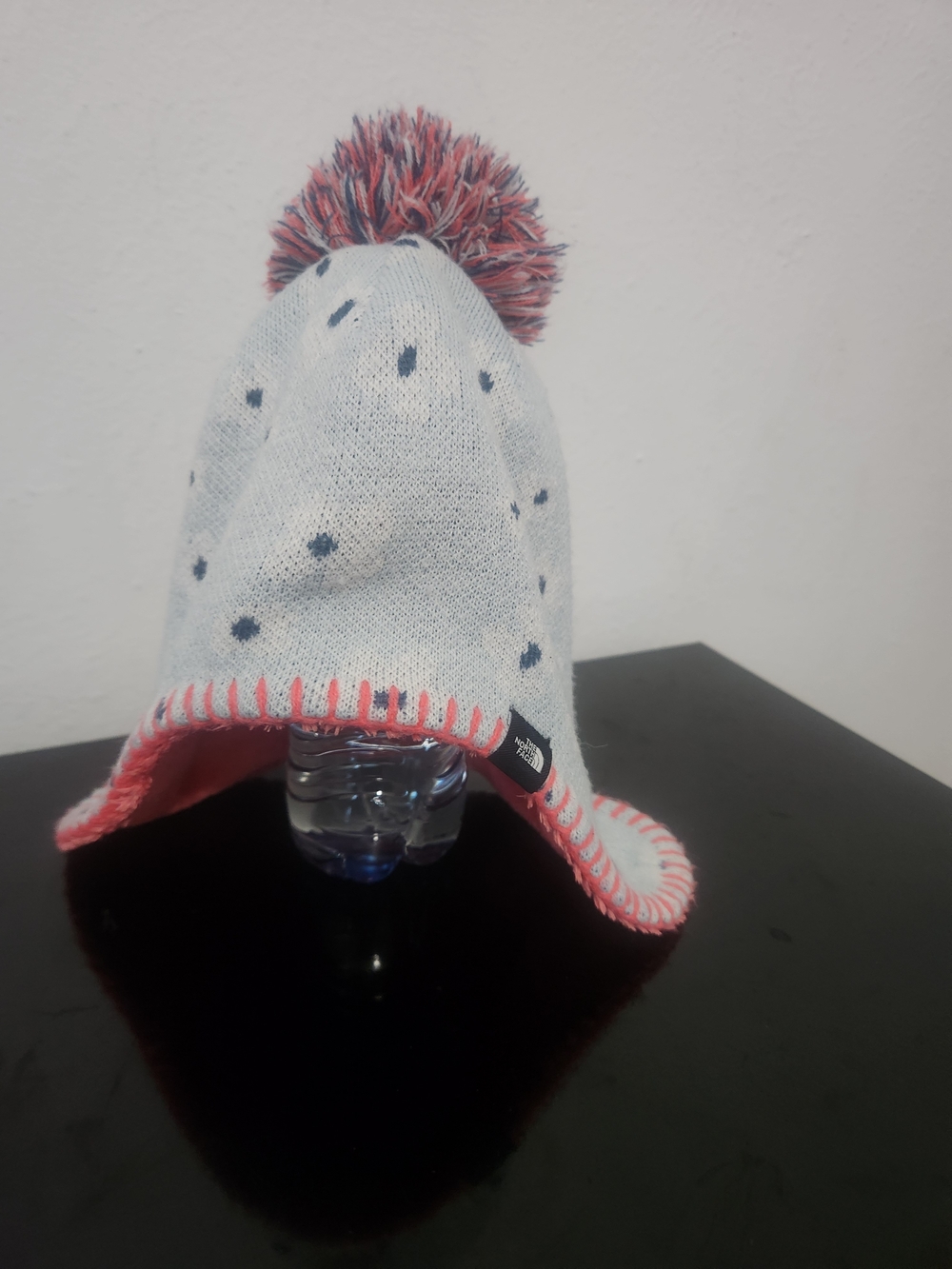 The North Face Kids Earflap Pom Beanie in Light Gray and Pink